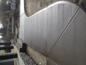 concrete sidewalk path walkway brush brushed broomed wavy deep cuts expansion joint joints
